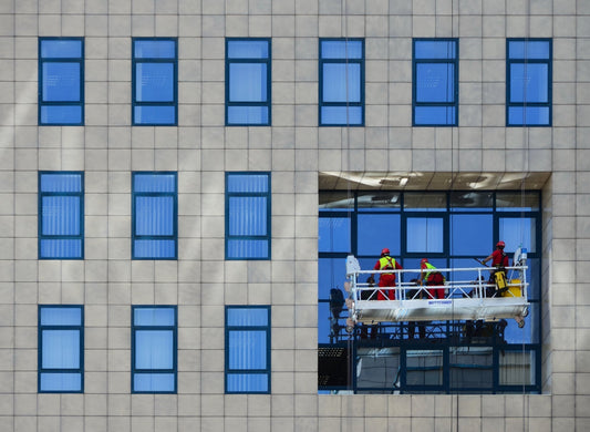 professional window cleaners cleaning a high rise