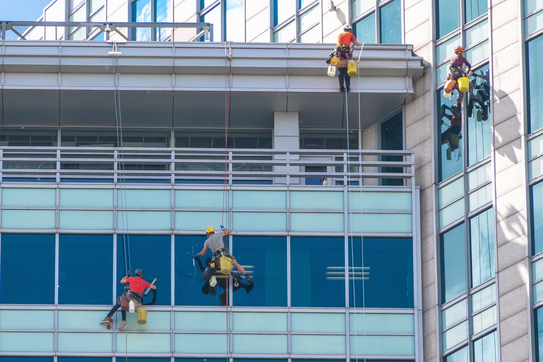 window cleaning crew cleaning a high rise building
