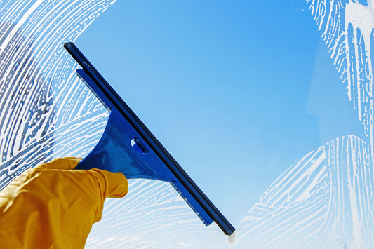 window squeegee on a soapy window